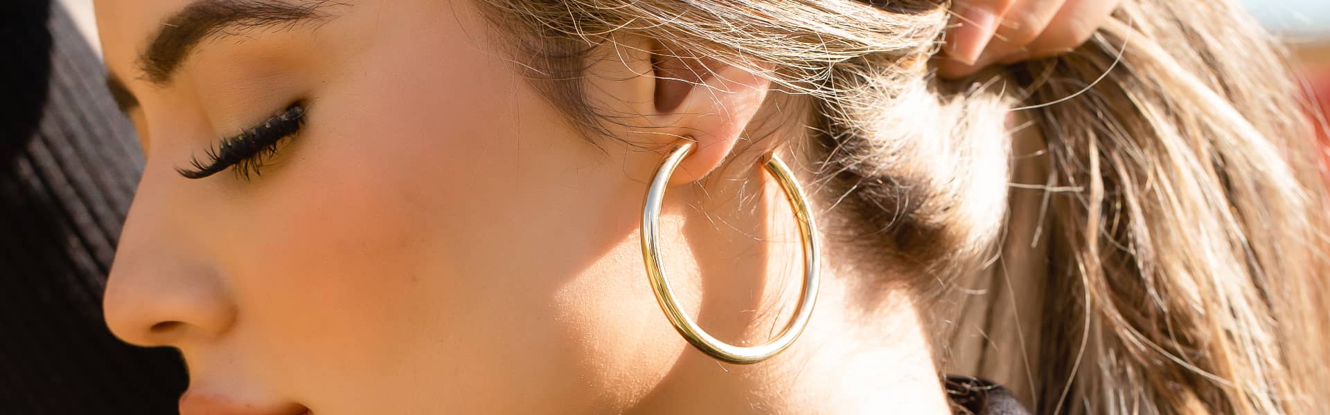 Model Wearing Gold Loop Earrings