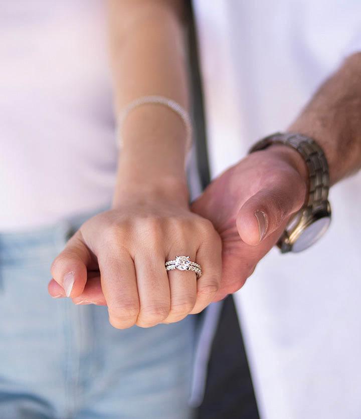 Models Holding Hands with a Diamond Ring and Luxury Watch